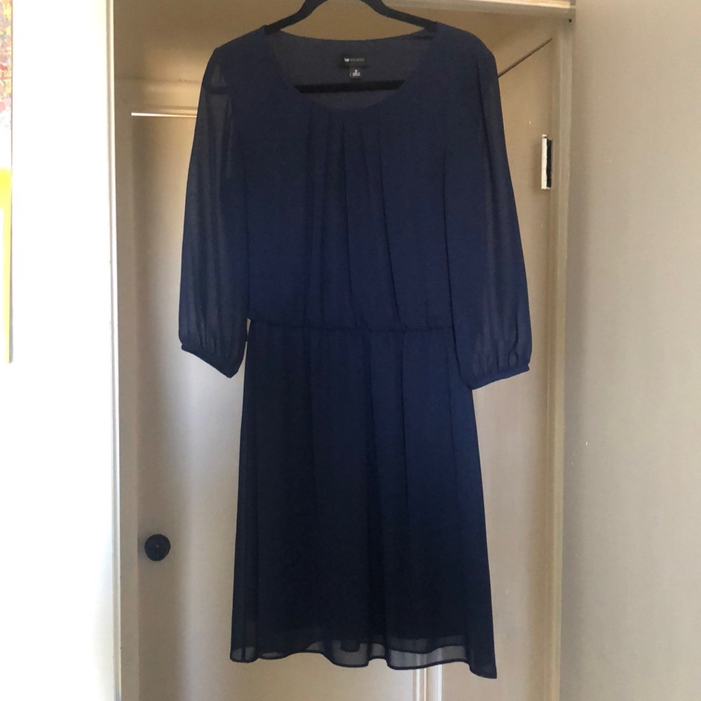 Beautiful navy dress; only worn a few times. No snags or blemishes